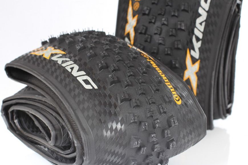 Покришка 27,5" Continental X-King 27,5x2,2 PureGrip Performance Skin TLR Foldable Black 154037 фото